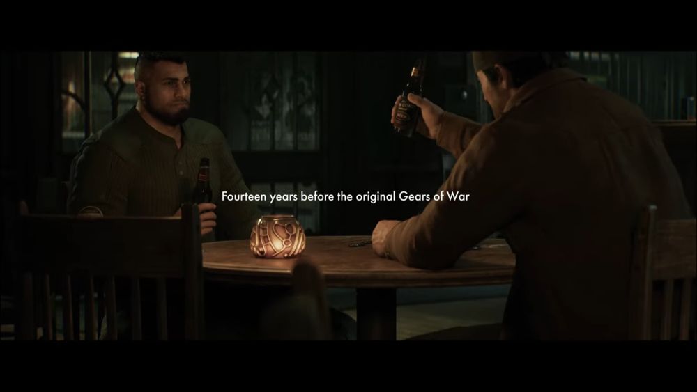 Marcus Fenix i Dominic Santiago sede za stolom u sceni smeštenoj 14 godina pre originalnog Gears of War.